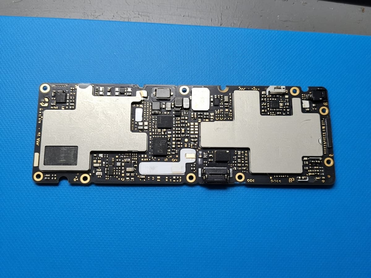 Cleaned phone board after water-damage recovery