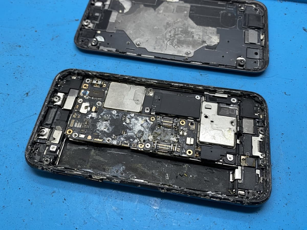 Water-damaged phone board before recovery work